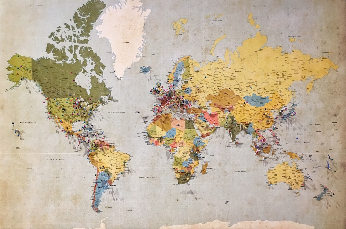 World map with pins marking places around the globe