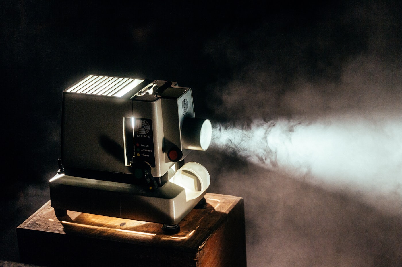 Film projector casting a beam of light through haze